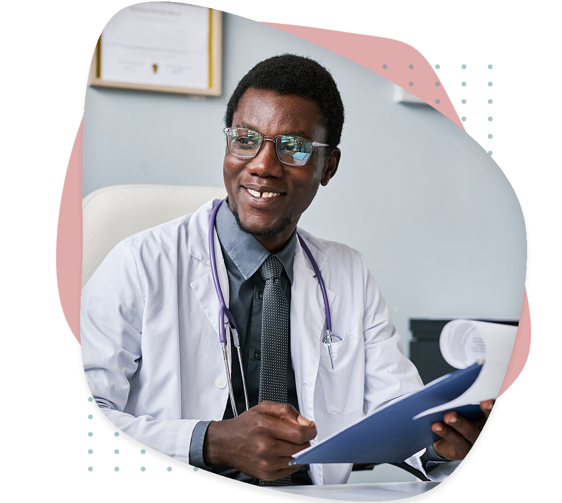 A smiling doctor with a labcoat and tie