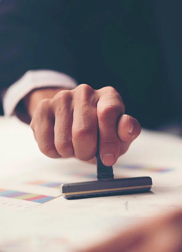 Certified vs. notarized translation: notary stamping a translated document